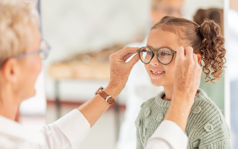 Illustration of a child trying on Myopia control lens eyewear