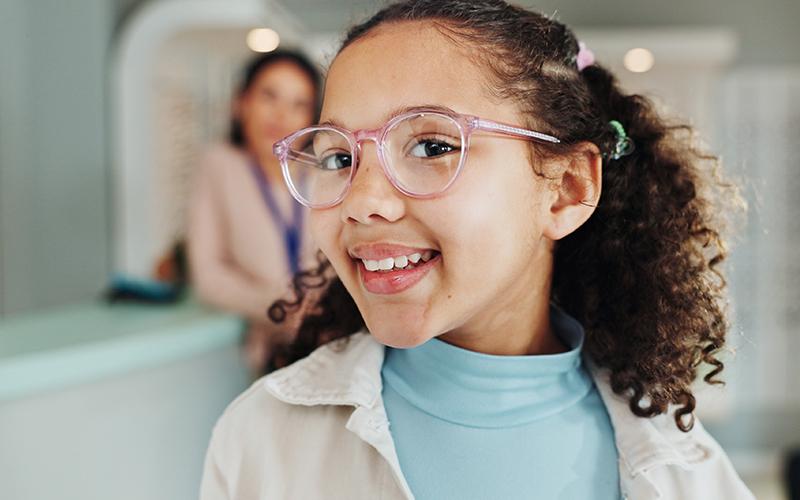 Close-up of a girl wearing glasses with prescription lenses