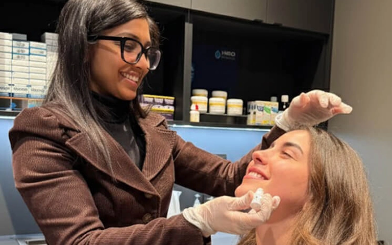Dr. Harina Thyriar, Optometrist, assessing and treating a patient with an eyelid condition at HARINA Optométristes in Mont-Royal