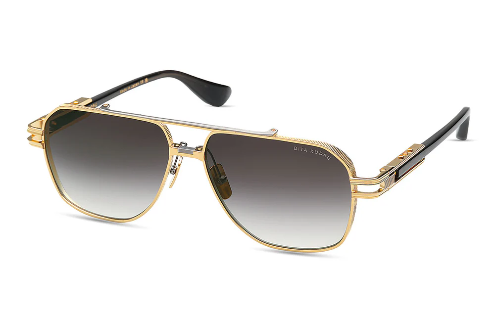The bold DITA KUDRU sunglasses in Yellow Gold and Black, showcasing their oversized shape at HARINA Optométristes.